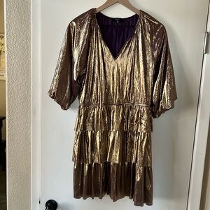 Fate mini dress. Az L. Festive. Gold color with purple undertone. Worn once.